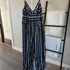 Black jumpsuit with floral stripes